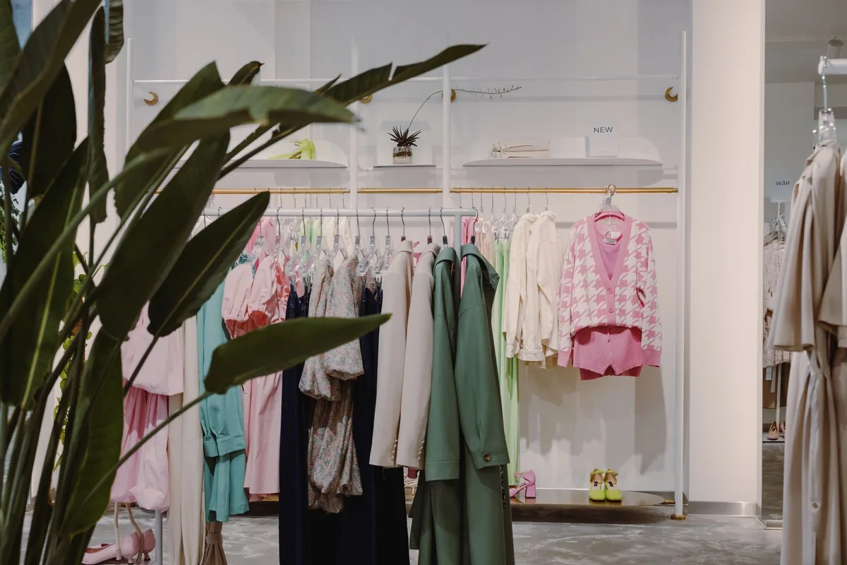 Vibrant clothing rack with diverse apparel in a contemporary boutique setting.